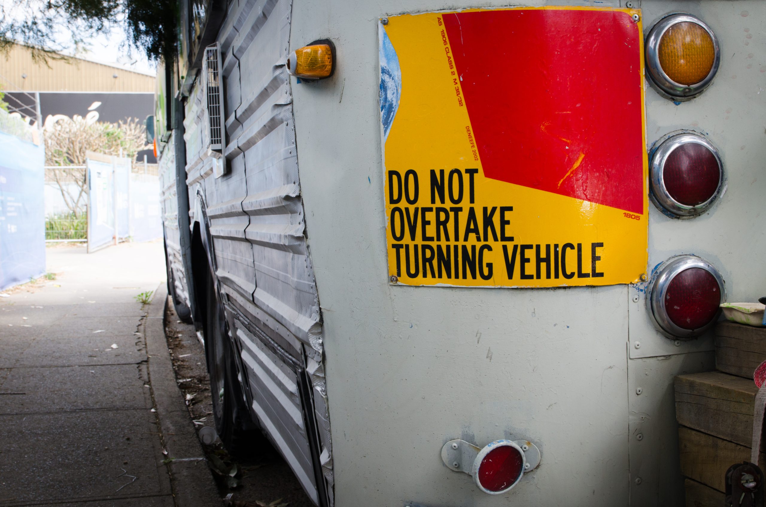 Do not overtake turning vehicle sign.