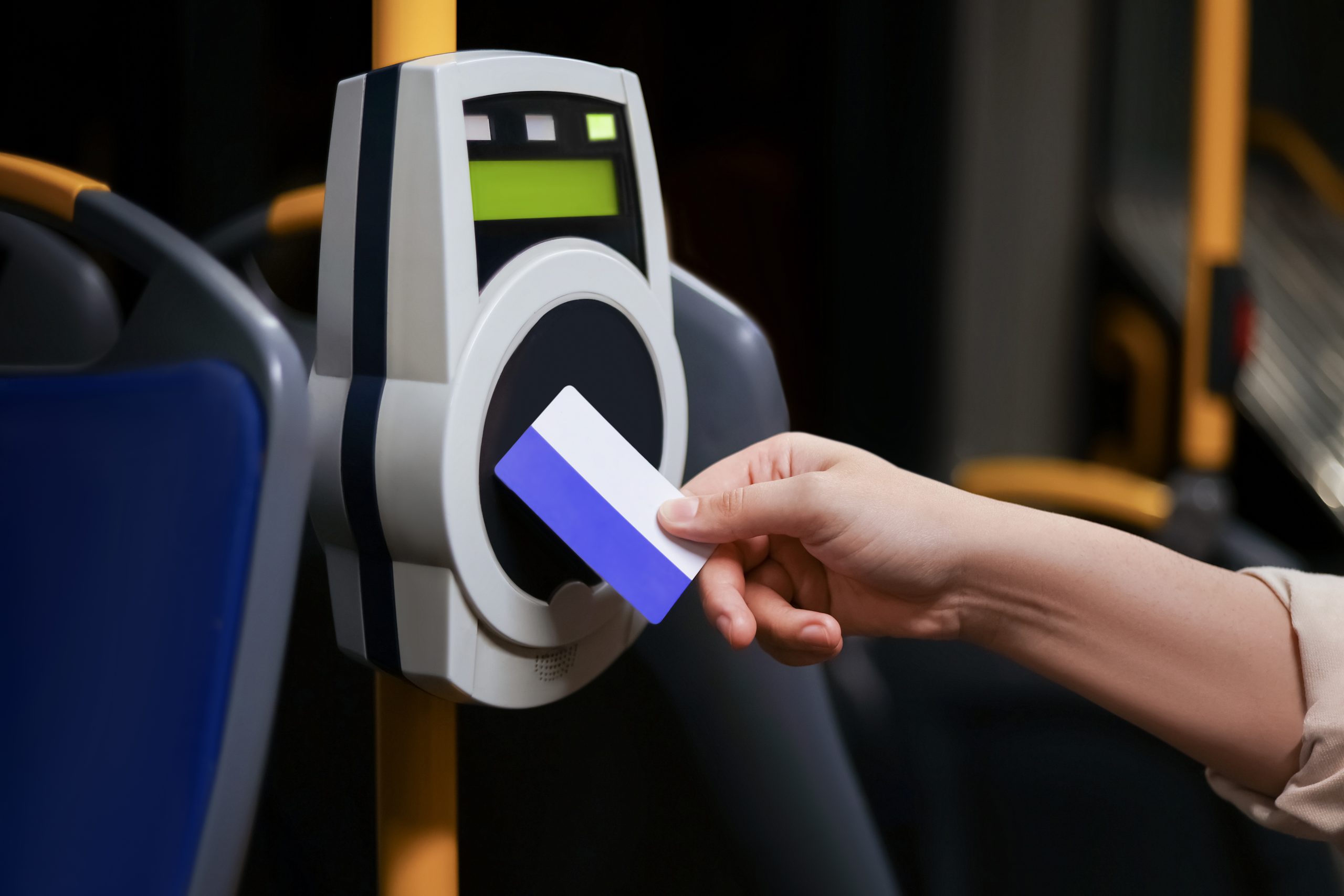 Hand paying for public transport with contactless card